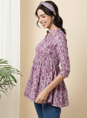 Woman wearing a brown indian kurti for women by Nishtha Chadda