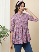 Woman wearing a brown indian kurti for women by Nishtha Chadda