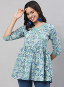 Woman wearing a grey indian kurti for women by Nishtha Chadda