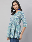 Woman wearing a grey indian kurti for women by Nishtha Chadda