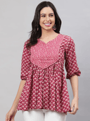 Woman wearing a grey indian kurti for women by Nishtha Chadda