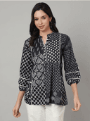 Woman wearing a grey indian kurti for women by Nishtha Chadda