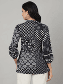 Woman wearing a grey indian kurti for women by Nishtha Chadda