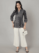 Woman wearing a grey indian kurti for women by Nishtha Chadda