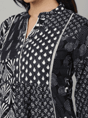 Woman wearing a grey indian kurti for women by Nishtha Chadda
