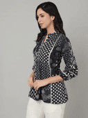 Woman wearing a grey indian kurti for women by Nishtha Chadda