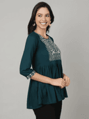 Woman wearing a black indian kurti for women by Nishtha Chadda