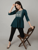 Woman wearing a black indian kurti for women by Nishtha Chadda