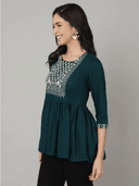 Woman wearing a black indian kurti for women by Nishtha Chadda