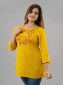 Woman wearing a black indian kurti for women by Nishtha Chadda