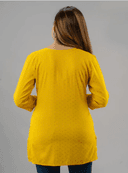 Woman wearing a black indian kurti for women by Nishtha Chadda