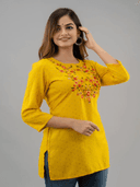 Woman wearing a black indian kurti for women by Nishtha Chadda