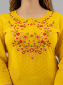 Woman wearing a black indian kurti for women by Nishtha Chadda