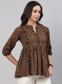 Woman wearing a brown indian kurti for women by Nishtha Chadda