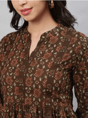 Woman wearing a brown indian kurti for women by Nishtha Chadda