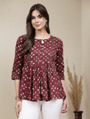 Woman wearing a brown indian kurti for women by Nishtha Chadda