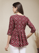 Woman wearing a brown indian kurti for women by Nishtha Chadda