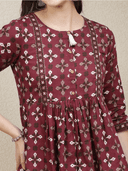 Woman wearing a brown indian kurti for women by Nishtha Chadda