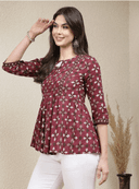 Woman wearing a brown indian kurti for women by Nishtha Chadda