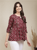 Woman wearing a brown indian kurti for women by Nishtha Chadda