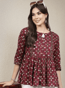 Woman wearing a brown indian kurti for women by Nishtha Chadda