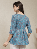 Woman wearing a grey indian kurti for women by Nishtha Chadda