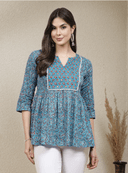 Woman wearing a grey indian kurti for women by Nishtha Chadda
