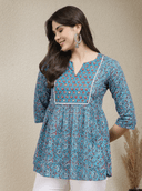 Woman wearing a grey indian kurti for women by Nishtha Chadda
