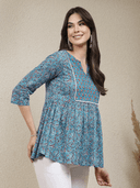 Woman wearing a grey indian kurti for women by Nishtha Chadda