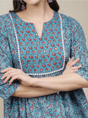 Woman wearing a grey indian kurti for women by Nishtha Chadda