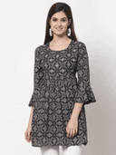 Woman wearing a grey indian kurti for women by Nishtha Chadda
