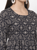 Woman wearing a grey indian kurti for women by Nishtha Chadda