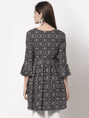 Woman wearing a grey indian kurti for women by Nishtha Chadda