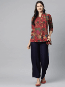 Woman wearing a brown indian kurti for women by Nishtha Chadda