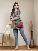 Woman wearing a brown indian kurti for women by Nishtha Chadda