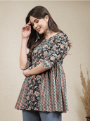 Woman wearing a brown indian kurti for women by Nishtha Chadda