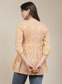 Woman wearing a grey indian kurti for women by Nishtha Chadda