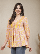 Woman wearing a grey indian kurti for women by Nishtha Chadda