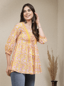 Woman wearing a grey indian kurti for women by Nishtha Chadda
