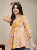 Woman wearing a grey indian kurti for women by Nishtha Chadda
