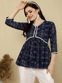 Woman wearing a brown indian kurti for women by Nishtha Chadda