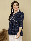 Woman wearing a brown indian kurti for women by Nishtha Chadda