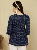 Woman wearing a brown indian kurti for women by Nishtha Chadda