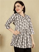Woman wearing a brown indian kurti for women by Nishtha Chadda