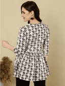 Woman wearing a brown indian kurti for women by Nishtha Chadda