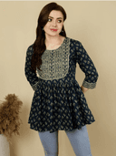 Woman wearing a brown indian kurti for women by Nishtha Chadda