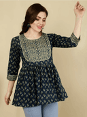 Woman wearing a brown indian kurti for women by Nishtha Chadda