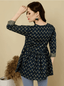 Woman wearing a brown indian kurti for women by Nishtha Chadda