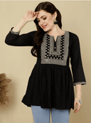 Woman wearing a brown indian kurti for women by Nishtha Chadda