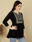 Woman wearing a brown indian kurti for women by Nishtha Chadda